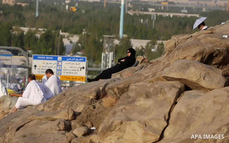 Muslim pilgrims pray on Mount Arafat, as Jabal al-Rahma near Mecca, as they take part in one of the Hajj rituals southeast of the Saudi holy city of Mecca on August 10, 2019. Arafat is the site where Muslims believe the...