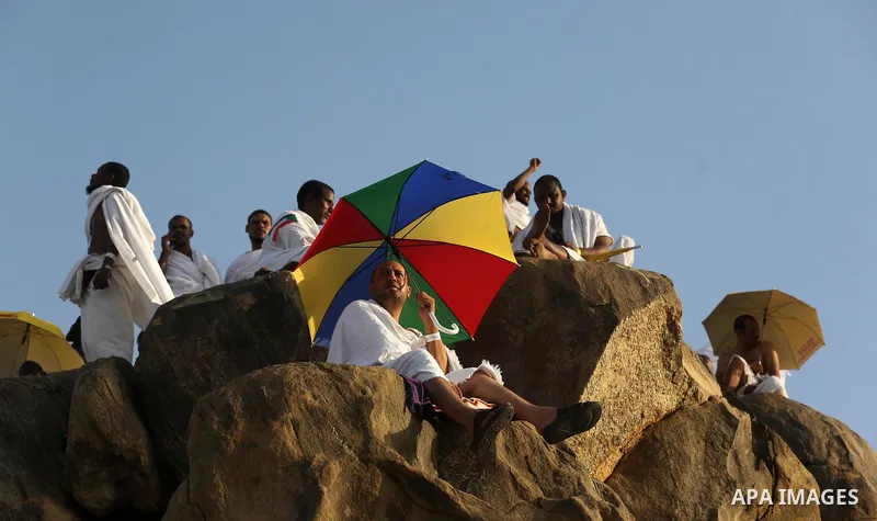 Muslim pilgrims pray on Mount Arafat, as Jabal al-Rahma near Mecca, as they take part in one of the Hajj rituals southeast of the Saudi holy city of Mecca on August 10, 2019. Arafat is the site where Muslims believe the...
