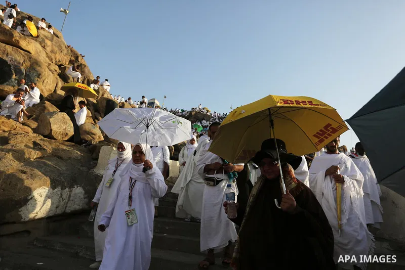 Muslim pilgrims pray on Mount Arafat, as Jabal al-Rahma near Mecca, as they take part in one of the Hajj rituals southeast of the Saudi holy city of Mecca on August 10, 2019. Arafat is the site where Muslims believe the...