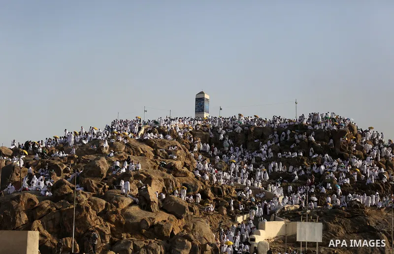 Muslim pilgrims pray on Mount Arafat, as Jabal al-Rahma near Mecca, as they take part in one of the Hajj rituals southeast of the Saudi holy city of Mecca on August 10, 2019. Arafat is the site where Muslims believe the...