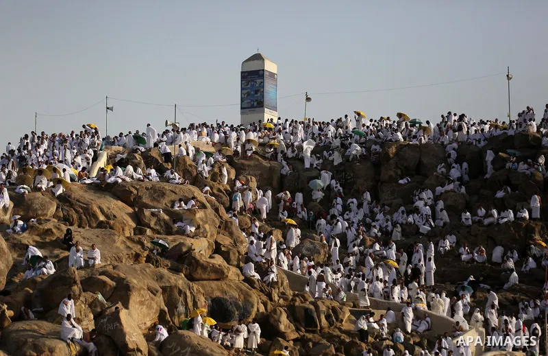 Muslim pilgrims pray on Mount Arafat, as Jabal al-Rahma near Mecca, as they take part in one of the Hajj rituals southeast of the Saudi holy city of Mecca on August 10, 2019. Arafat is the site where Muslims believe the...