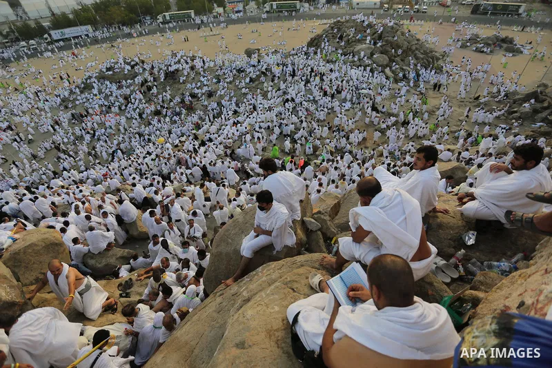 Muslim pilgrims pray on Mount Arafat, as Jabal al-Rahma near Mecca, as they take part in one of the Hajj rituals southeast of the Saudi holy city of Mecca on August 10, 2019. Arafat is the site where Muslims believe the...