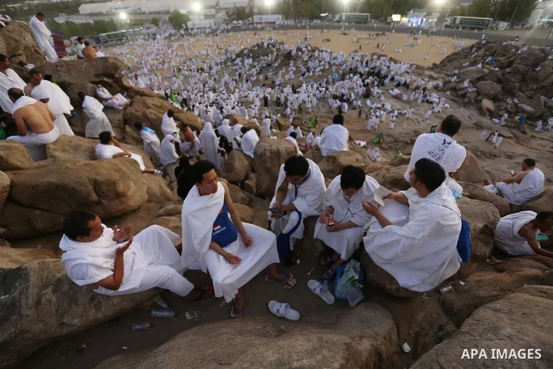 Muslim pilgrims pray on Mount Arafat, as Jabal al-Rahma near Mecca, as they take part in one of the Hajj rituals southeast of the Saudi holy city of Mecca on August 10, 2019. Arafat is the site where Muslims believe the...