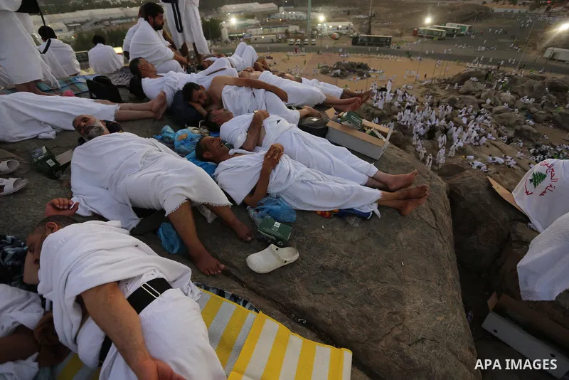 Muslim pilgrims pray on Mount Arafat, as Jabal al-Rahma near Mecca, as they take part in one of the Hajj rituals southeast of the Saudi holy city of Mecca on August 10, 2019. Arafat is the site where Muslims believe the...