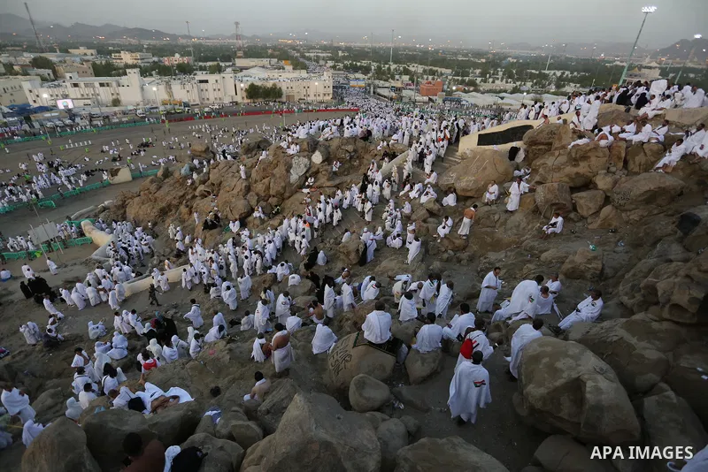 Muslim pilgrims pray on Mount Arafat, as Jabal al-Rahma near Mecca, as they take part in one of the Hajj rituals southeast of the Saudi holy city of Mecca on August 10, 2019. Arafat is the site where Muslims believe the...