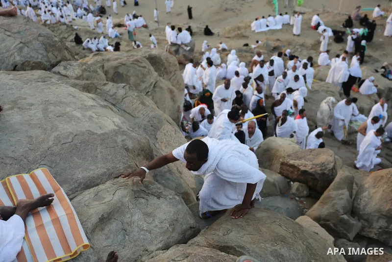 Muslim pilgrims pray on Mount Arafat, as Jabal al-Rahma near Mecca, as they take part in one of the Hajj rituals southeast of the Saudi holy city of Mecca on August 10, 2019. Arafat is the site where Muslims believe the...