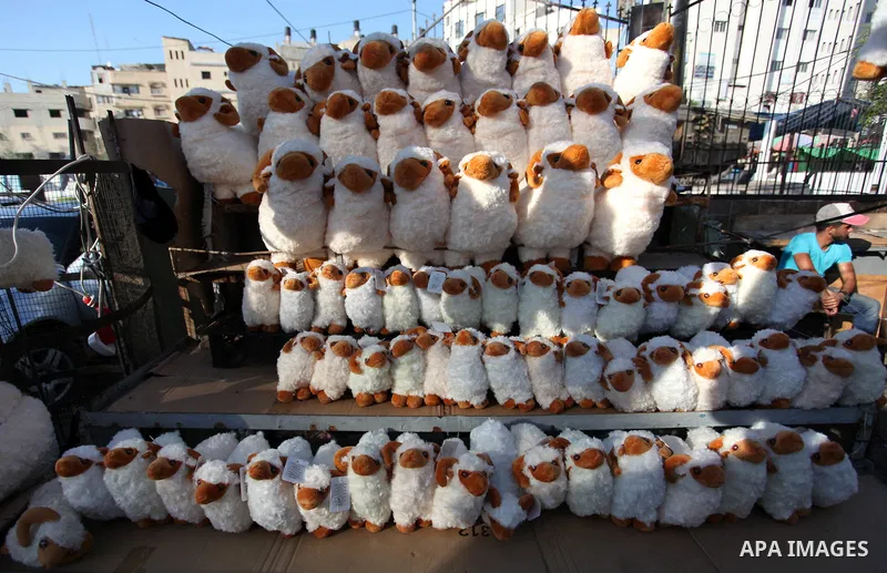 Palestinian shop at a market ahead of Eid al-Adha festival Gaza city on August 10, 2019. Muslims across the world are preparing for the Eid al-Adha holiday when custom requires the faithful to make a sacrifice. Photo by...