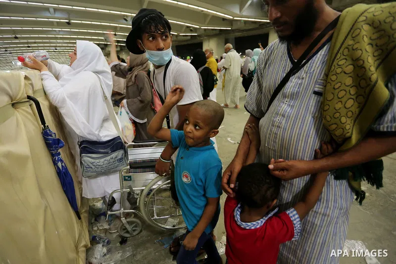Muslim pilgrims arrive to throw pebbles at pillars during the "Jamarat" ritual, the stoning of Satan, in Mina near the holy city of Mecca, on August 13, 2019. Pilgrims pelt pillars symbolizing the devil with pebbles to s...