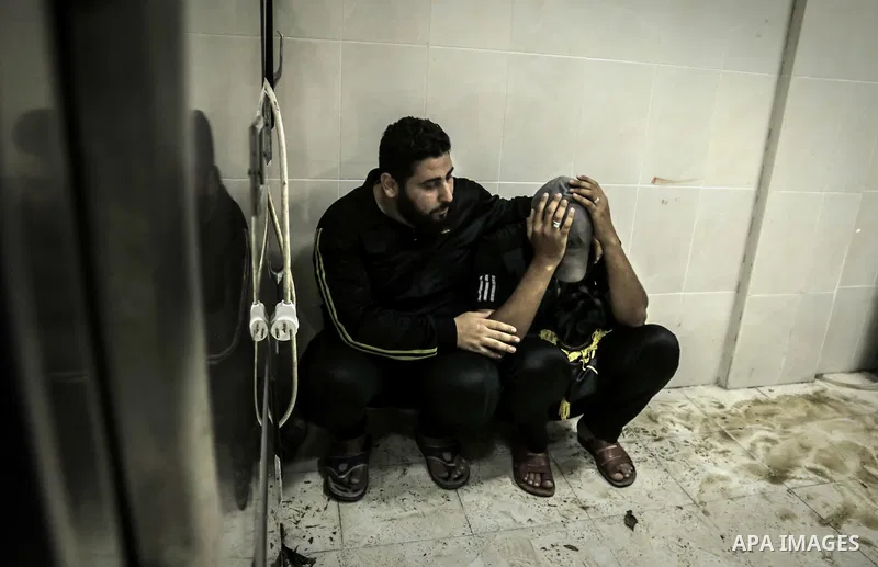 Relative of a Palestinian gunman who was shot dead by Israeli security forces, react at Indonesian hospital in the northern Gaza Strip August 18, 2019. Israeli forces last night killed three Palestinians and injured a fo...
