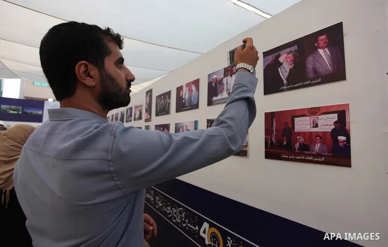Palestinians attend an exhibition marking the 40th anniversary of the founding of the Islamic University, in Gaza city on August 19, 2019. Photo by Mahmoud Ajjour