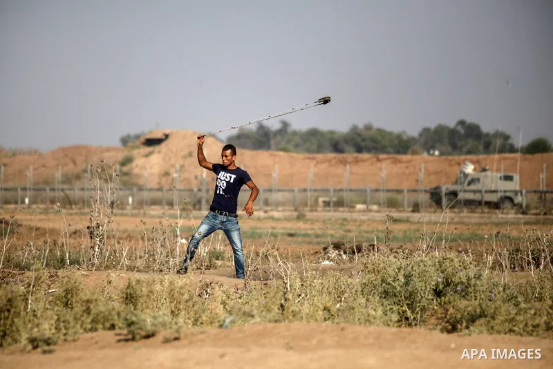 Palestinian protesters clash with Israeli troops following the tents protest where Palestinians demand the right to return to their homeland at the Israel-Gaza border, in Jabalia in the northern Gaza Strip, August 23, 20...