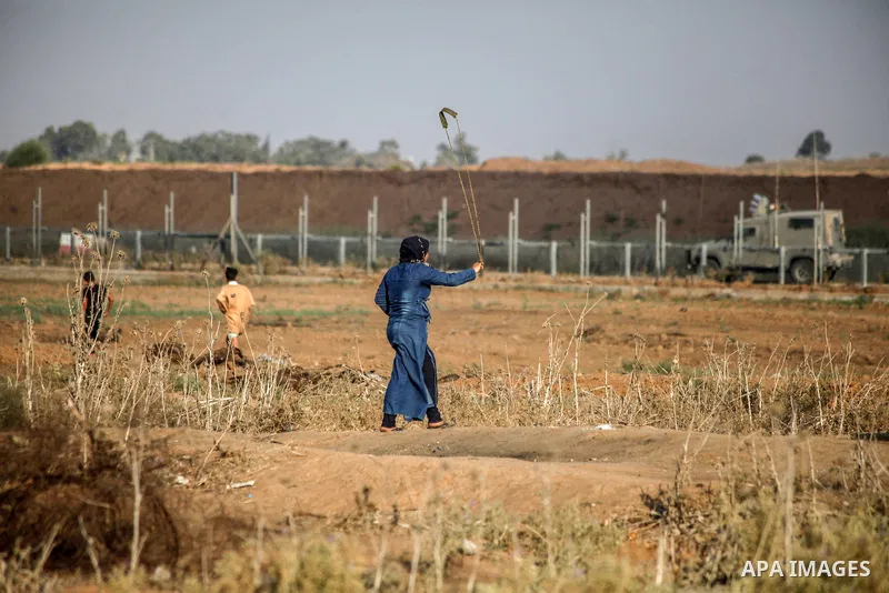 Palestinian protesters clash with Israeli troops following the tents protest where Palestinians demand the right to return to their homeland at the Israel-Gaza border, in Jabalia in the northern Gaza Strip, August 23, 20...