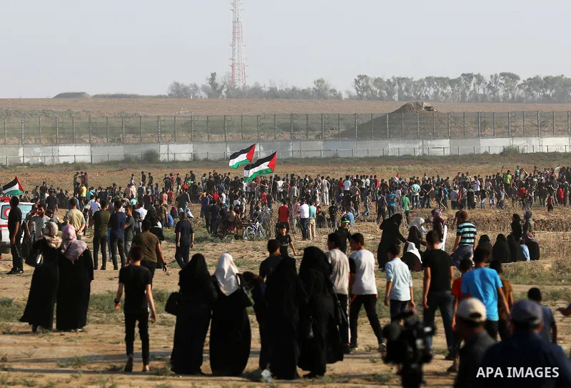 Palestinian protesters gather during the tents protest where Palestinians demand the right to return to their homeland at the Israel-Gaza border, in the east of Gaza city, August 23, 2019. Photo by Mahmoud Nasser