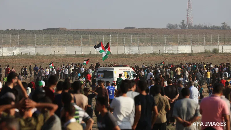 Palestinian protesters gather during the tents protest where Palestinians demand the right to return to their homeland at the Israel-Gaza border, in the east of Gaza city, August 23, 2019. Photo by Mahmoud Nasser