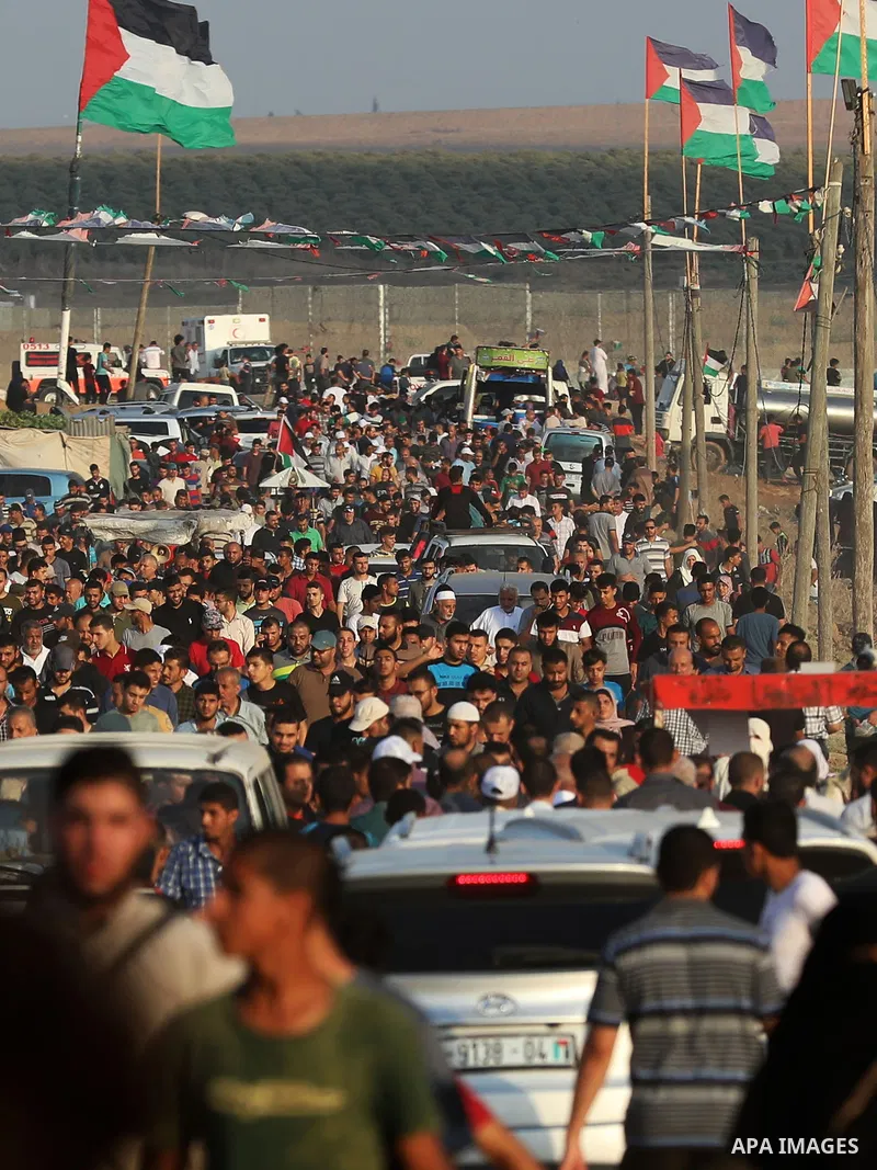 Palestinian protesters gather during the tents protest where Palestinians demand the right to return to their homeland at the Israel-Gaza border, in the east of Gaza city, August 23, 2019. Photo by Mahmoud Nasser