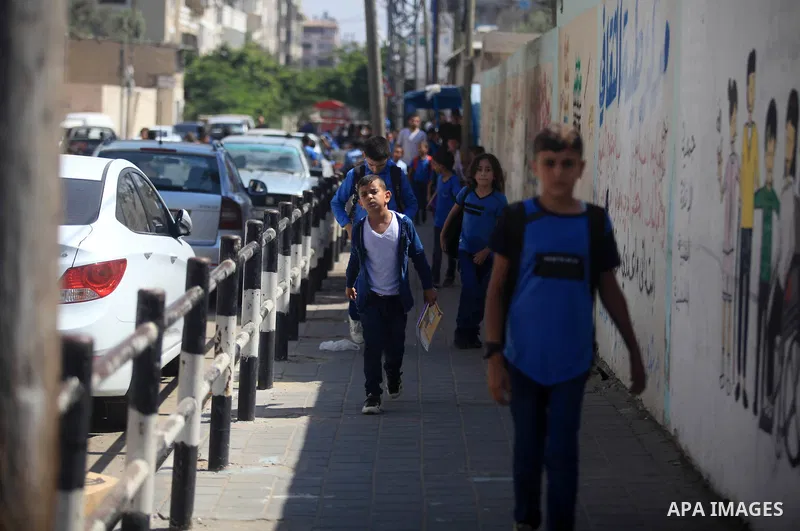 Palestinian students return back to their school in the morning of the first day of the new year study in Gaza City, on August 25, 2019. Photo by Mahmoud Ajjour