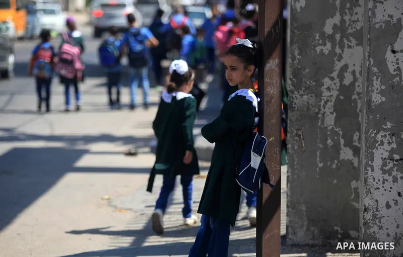 Palestinian students return back to their school in the morning of the first day of the new year study in Gaza City, on August 25, 2019. Photo by Mahmoud Ajjour