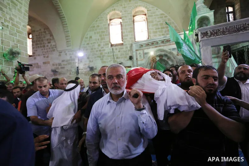 Head of the Political Bureau of Hamas Ismail Haniyeh attends the funeral of Palestinian policemen Salama al-Nadeem and Alaa al-Gharabli, in Gaza City on August 28, 2019. Three officers were killed on Tuesday when explosi...