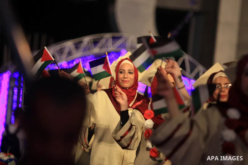 Palestinian students attend their graduation ceremony at al-Esraa University in Gaza city on August 29, 2019. Photo by Mahmoud Ajjour