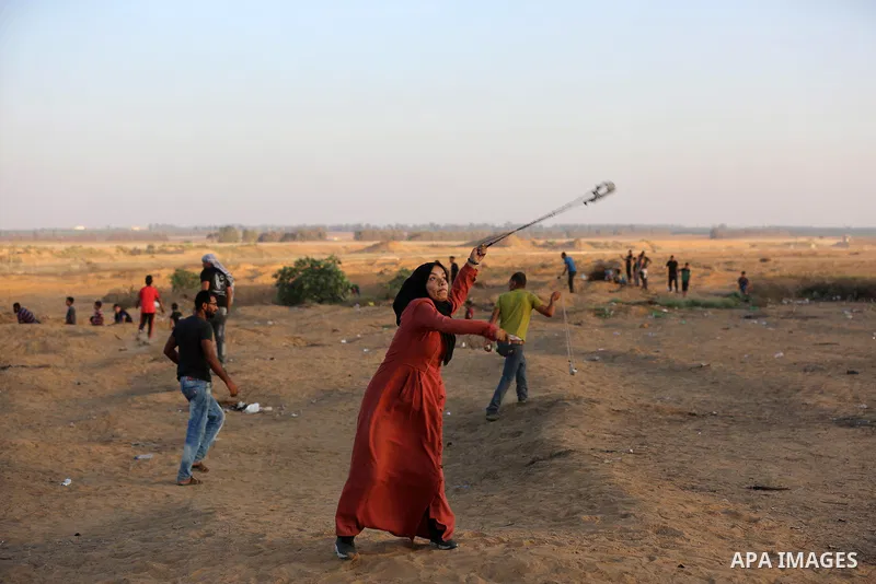 Palestinian protesters clash with Israeli troops following the tents protest where Palestinians demand the right to return to their homeland at the Israel-Gaza border, in Khan Younis in the southern Gaza Strip, August 30...