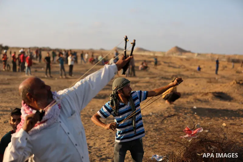 Palestinian protesters clash with Israeli troops following the tents protest where Palestinians demand the right to return to their homeland at the Israel-Gaza border, in Khan Younis in the southern Gaza Strip, August 30...
