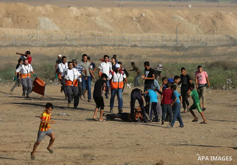 A wounded Palestinian protester is evacuated during clashes with Israeli troops following the tents protest where Palestinians demand the right to return to their homeland at the Israel-Gaza border, in Khan Younis in the...
