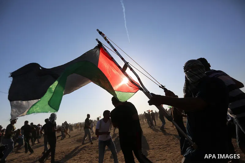 Palestinian protesters clash with Israeli troops following the tents protest where Palestinians demand the right to return to their homeland at the Israel-Gaza border, in Khan Younis in the southern Gaza Strip, September...