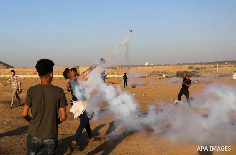 Palestinian protesters clash with Israeli troops following the tents protest where Palestinians demand the right to return to their homeland at the Israel-Gaza border, in Khan Younis in the southern Gaza Strip, September...
