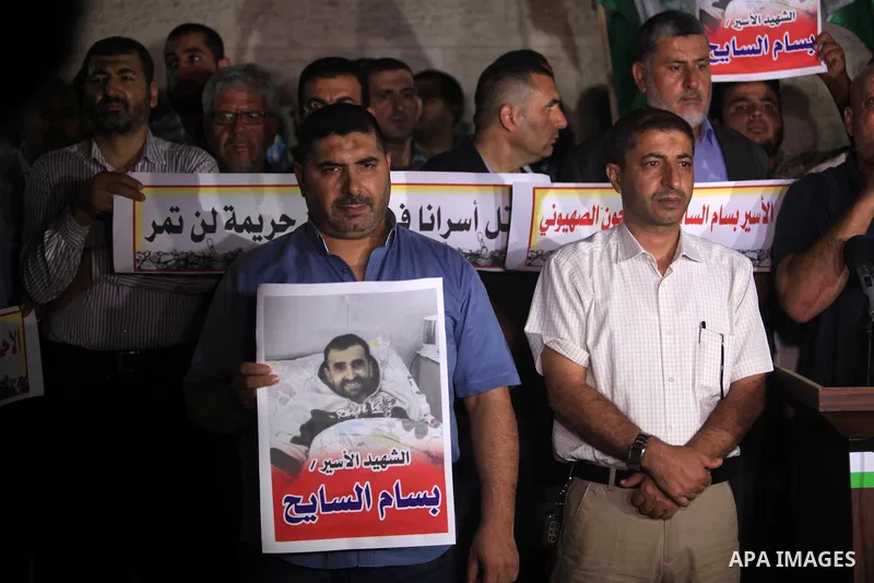 Palestinians take part in a protst against the death of the prisoner Bassam Al-Sayeh in the in the Israeli jails, outside the Red Cross headquarter in Gaza city, September 08, 2019. Al-Sayeh, 47, was detained in 2015 and...
