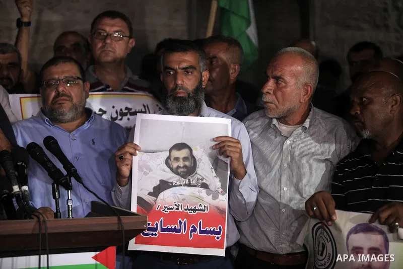 Palestinians take part in a protst against the death of the prisoner Bassam Al-Sayeh in the in the Israeli jails, outside the Red Cross headquarter in Gaza city, September 08, 2019. Al-Sayeh, 47, was detained in 2015 and...