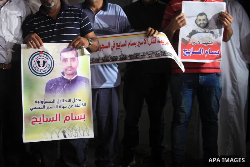Palestinians take part in a protst against the death of the prisoner Bassam Al-Sayeh in the in the Israeli jails, outside the Red Cross headquarter in Gaza city, September 08, 2019. Al-Sayeh, 47, was detained in 2015 and...