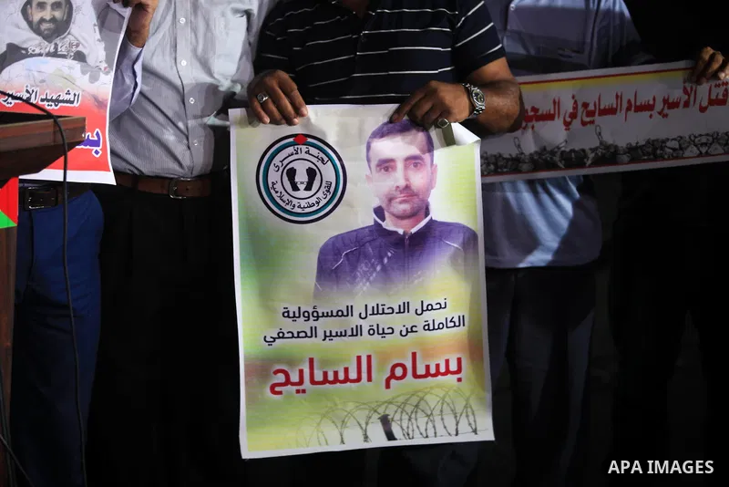Palestinians take part in a protst against the death of the prisoner Bassam Al-Sayeh in the in the Israeli jails, outside the Red Cross headquarter in Gaza city, September 08, 2019. Al-Sayeh, 47, was detained in 2015 and...