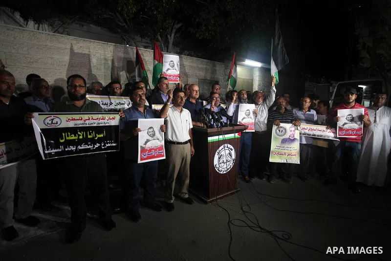 Palestinians take part in a protst against the death of the prisoner Bassam Al-Sayeh in the in the Israeli jails, outside the Red Cross headquarter in Gaza city, September 08, 2019. Al-Sayeh, 47, was detained in 2015 and...