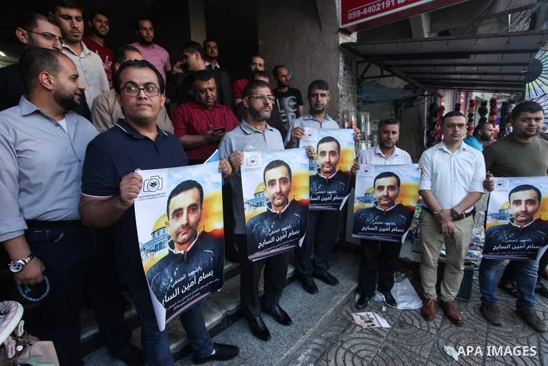 Palestinians take part in a protest against the death of the prisoner Bassam Al-Sayeh in the in the Israeli jails, in Gaza city on September 09, 2019. Al-Sayeh, 47, was detained in 2015 and was diagnosed with bone cancer...