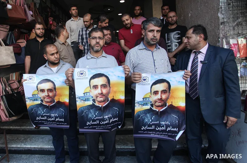 Palestinians take part in a protest against the death of the prisoner Bassam Al-Sayeh in the in the Israeli jails, in Gaza city on September 09, 2019. Al-Sayeh, 47, was detained in 2015 and was diagnosed with bone cancer...
