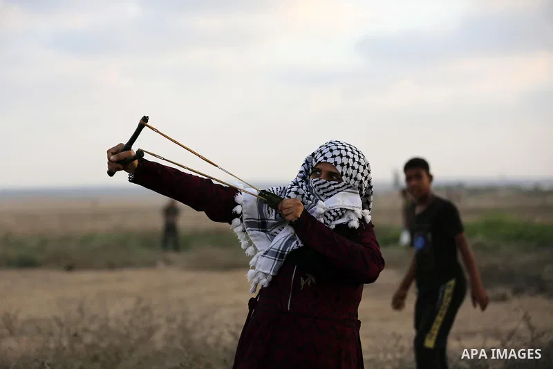 Palestinian protesters clash with Israeli troops following the tents protest where Palestinians demand the right to return to their homeland at the Israel-Gaza border, in Khan Younis in the southern Gaza Strip, September...