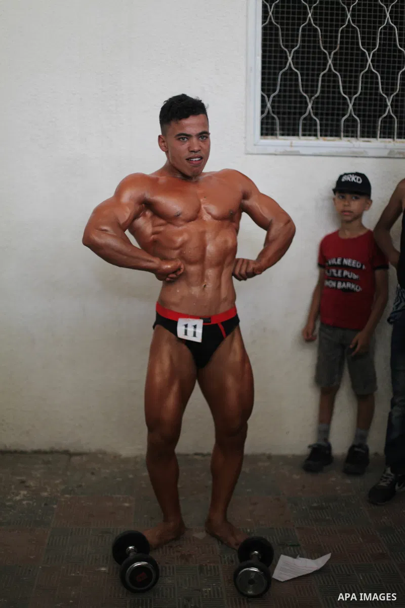 A Palestinian contestant takes part the Palestine Bodybuilding Championship in Gaza City, on september 15, 2019. Photo by Mahmoud Ajjour