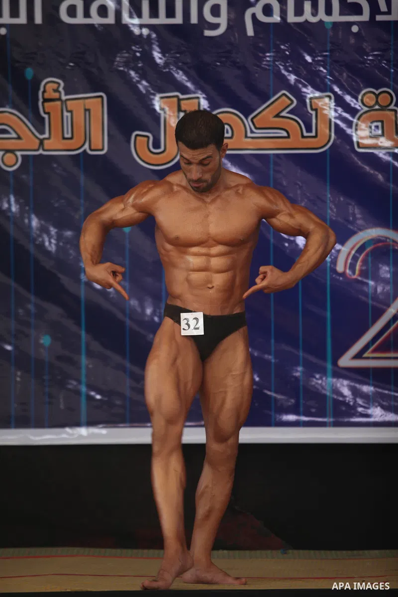 A Palestinian contestant takes part the Palestine Bodybuilding Championship in Gaza City, on september 15, 2019. Photo by Mahmoud Ajjour
