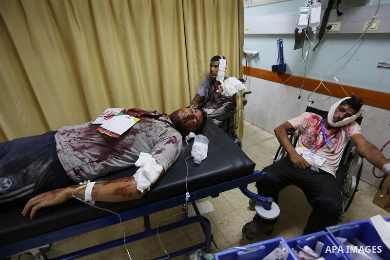 A Palestinian role-playing as an injured person is transported on a moving hospital bed into a hospital during an emergency drill for treating mass casualties organised by French humanitarian organisation Medecins du Mon...