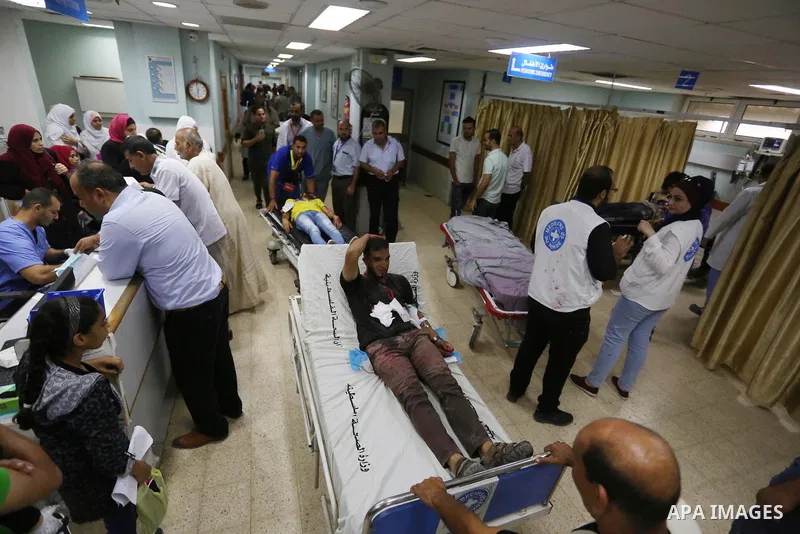 A Palestinian role-playing as an injured person is transported on a moving hospital bed into a hospital during an emergency drill for treating mass casualties organised by French humanitarian organisation Medecins du Mon...