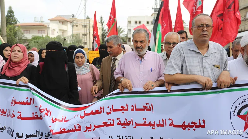 Palestinian supporters of the Democratic Front for the Liberation of Palestine (DFLP), take part in a protest to solidarity with prisoners from Israeli jails, in Khan Younis in the southern Gaza Strip, on September 19, 2...