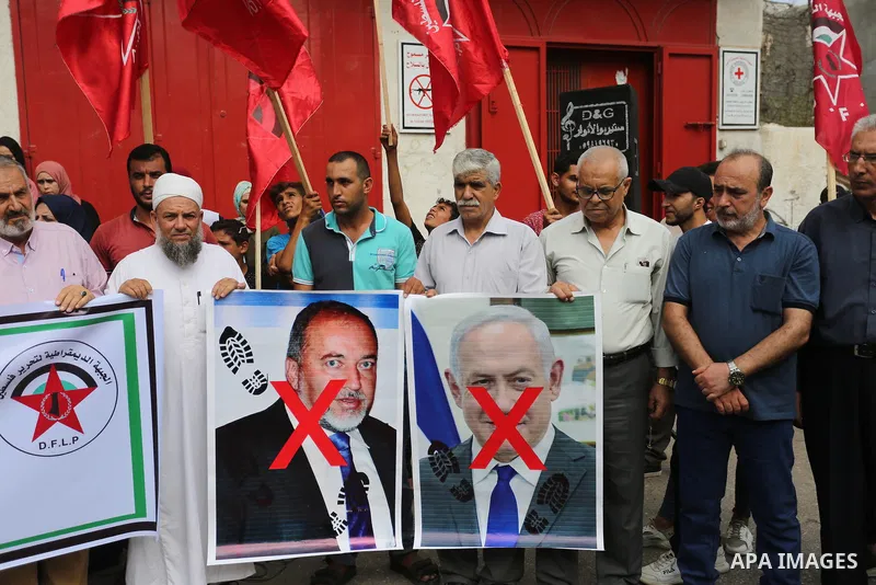 Palestinian supporters of the Democratic Front for the Liberation of Palestine (DFLP), take part in a protest to solidarity with prisoners from Israeli jails, in Khan Younis in the southern Gaza Strip, on September 19, 2...