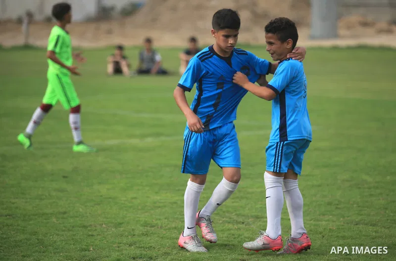 Palestinian players compete in a match of the "Malaysian-Palestinian Football league", Organizer by the Ministry of sport and youth, in Gaza city on September 19, 2019. Photo by Mahmoud Ajjour