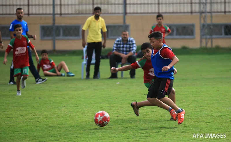 Palestinian players compete in a match of the "Malaysian-Palestinian Football league", Organizer by the Ministry of sport and youth, in Gaza city on September 19, 2019. Photo by Mahmoud Ajjour