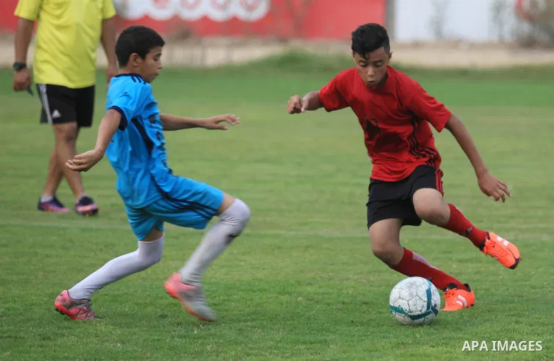 Palestinian players compete in a match of the "Malaysian-Palestinian Football league", Organizer by the Ministry of sport and youth, in Gaza city on September 19, 2019. Photo by Mahmoud Ajjour
