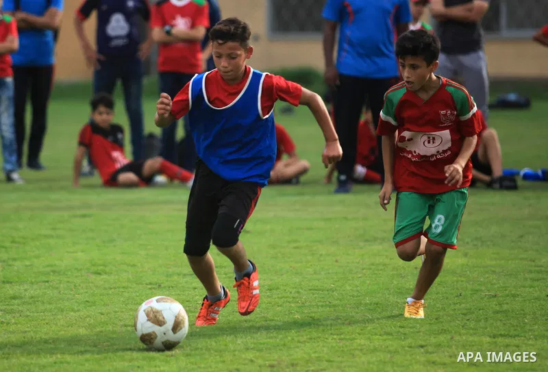 Palestinian players compete in a match of the "Malaysian-Palestinian Football league", Organizer by the Ministry of sport and youth, in Gaza city on September 19, 2019. Photo by Mahmoud Ajjour