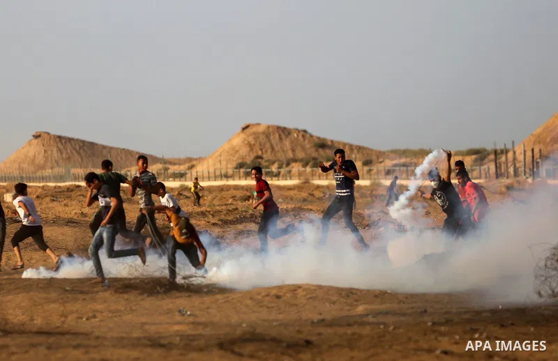 Palestinian protesters clash with Israeli troops following the tents protest where Palestinians demand the right to return to their homeland at the Israel-Gaza border, in Khan Younis in the southern Gaza Strip, Spetember...