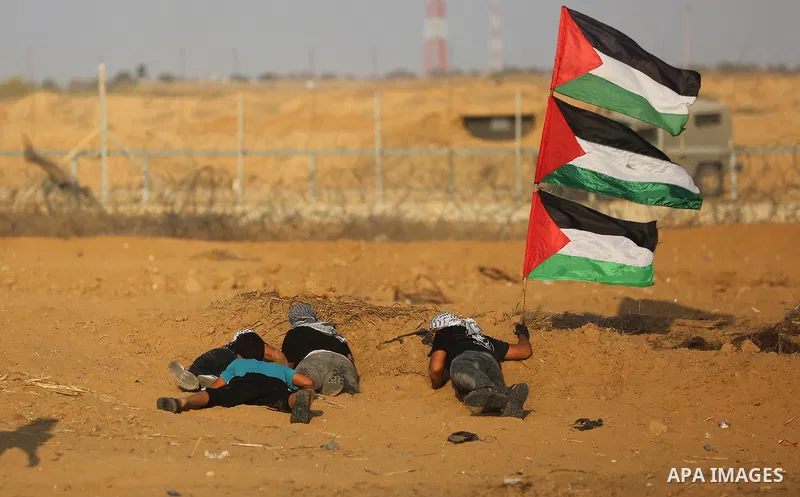Palestinian protesters clash with Israeli troops following the tents protest where Palestinians demand the right to return to their homeland at the Israel-Gaza border, in Khan Younis in the southern Gaza Strip, Spetember...