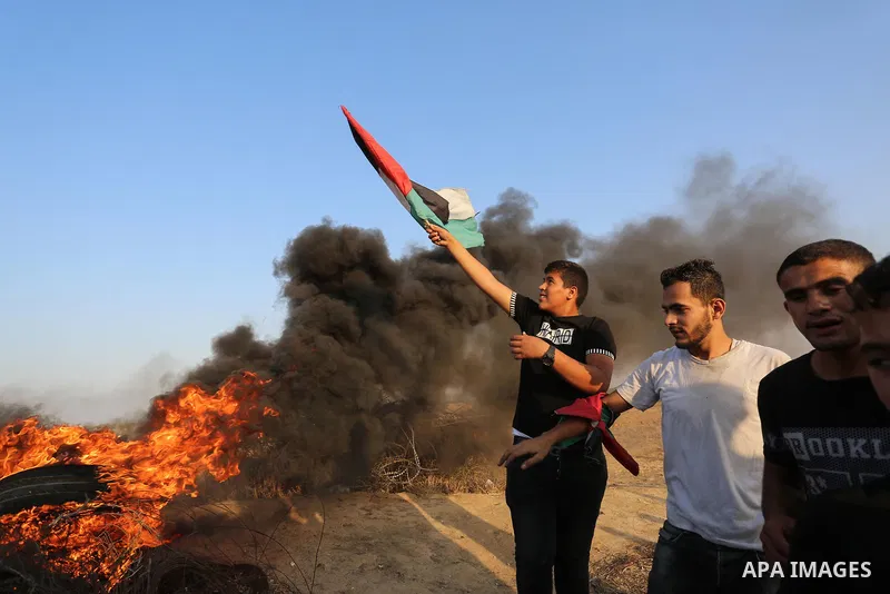Palestinian protesters clash with Israeli troops following the tents protest where Palestinians demand the right to return to their homeland at the Israel-Gaza border, in Khan Younis in the southern Gaza Strip, Spetember...