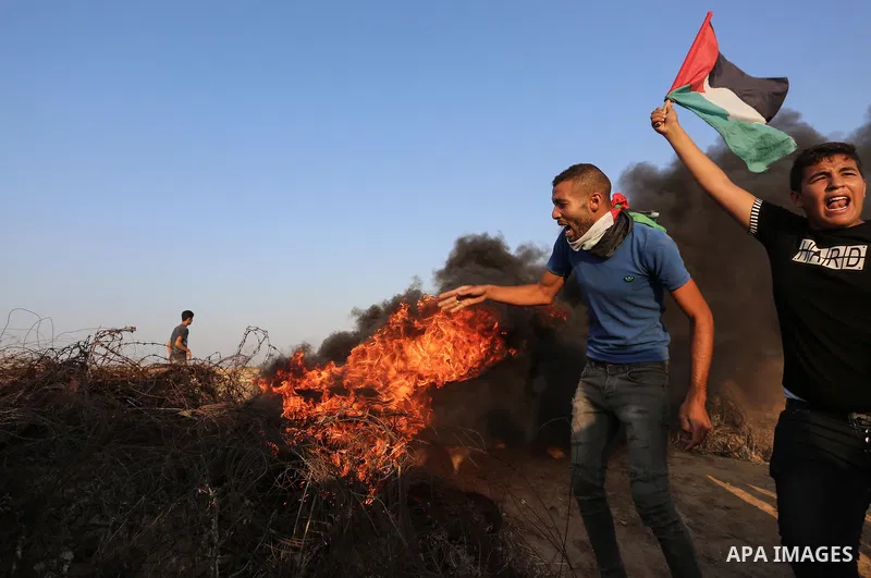 Palestinian protesters clash with Israeli troops following the tents protest where Palestinians demand the right to return to their homeland at the Israel-Gaza border, in Khan Younis in the southern Gaza Strip, Spetember...